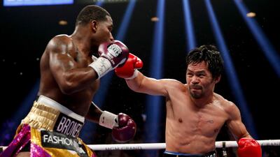 Manny Pacquiao throws a right to Adrien Broner. AP Photo
