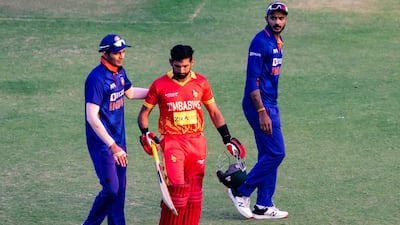 Zimbabwe's Sikandar Raza is consoled by Indian players after loosing his wicket during the third ODI at the Harare Sports Club on Monday, August 22, 2022. AFP