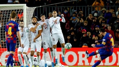Messi takes a free kick. EPA