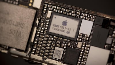 The Apple logo on the power management supply integrated circuit of an iPhone. Brent Lewin/Bloomberg