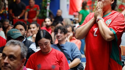 Morocco fans in Los Angeles, California, watch the World Cup quarter-final match against France. AFP