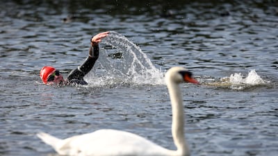 A competitor taking part in the 2021 Children with Cancer UK Swim Serpentine in London on Saturday, September 18. Reuters