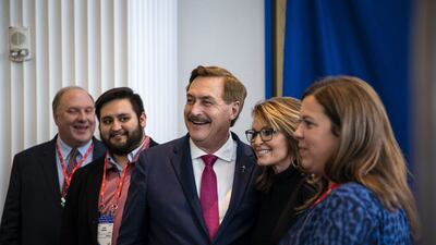 Mike Lindell, conspiracy theorist and chief executive of My Pillow, takes a photograph with Ms Palin. Bloomberg