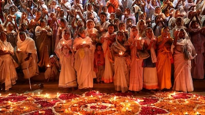 Widows burn earthen lamps as they participate in an event to mark Diwali in Vrindavan, India. EPA
