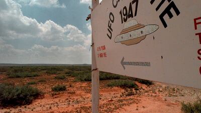 A sign in 1997 near Roswell, New Mexico, where in 1947, debris was recovered from what many claimed was a flying saucer. AP