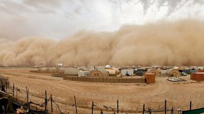 A handout photograph made available by the British Ministry of Defence shows the air around the British military base, Camp Bastion, Afghanistan, eerily still as a tidal wave of sand and dust approaches from the west. EPA