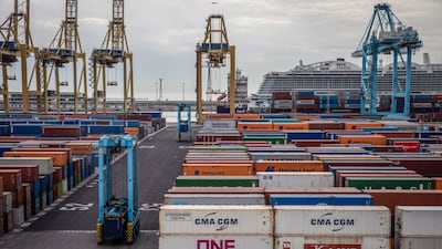 Shipping containers and gantry cranes dockside at the Port of Barcelona in Barcelona, Spain. The WTO anticipates growth in world trade. Bloomberg