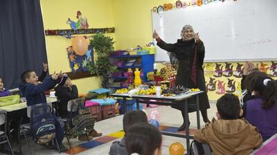 Hanan Al Hroub’s students held a surprise party for their award-winning teacher, when she returned to class on March 20, 2016. Heidi Levine for The National