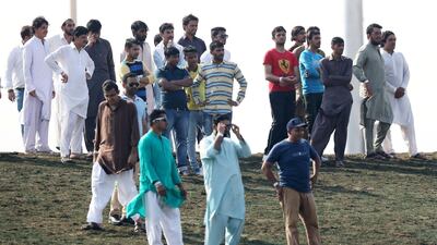 Fans watching the Abu Dhabi T20 cricket match between Lahore Qalanders vs Hobart Hurricanes.