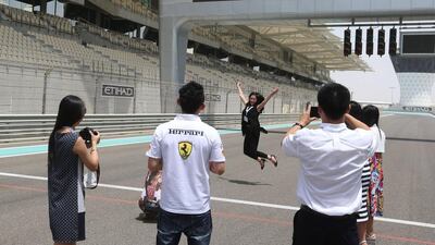 Up to 75 Chinese operators are joining the Chinese Visitor Summit on Yas Island. Above, some of the Chinese delegates on a tour of Yas Marina circuit. Delores Johnson / The National