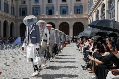 Veiled beekeeper hats at Thom Browne. Reuters