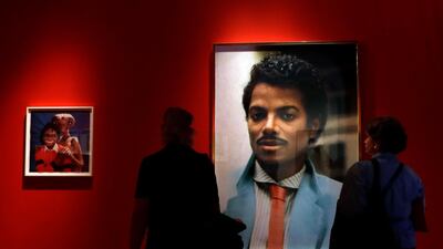 Visitors look at an artwork by Hank Willis Thomas on display at the "Michael Jackson: On The Wall" exhibition at the National Portrait Gallery in London, Britain, on June 27, 2018. Kirsty Wigglesworth / AP Photo