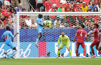 Yoane Wissa, centre, leaps to head home DR Congo's equaliser. AFP