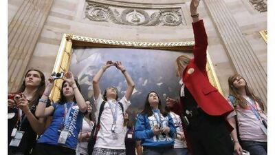 Schoolchildren take a guided tour of the Capitol Rotunda in Washington. A government shutdown would close the Capitol to tourists.