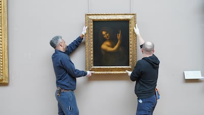 'Saint John the Baptist' was taken down from the wall of the Louvre Museum in Paris on Tuesday, beginning its journey to the UAE. Janelle Meager / The National