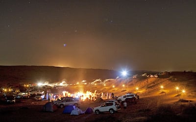 Campfires are a common sight in the desert by night. Jeff Topping / The National