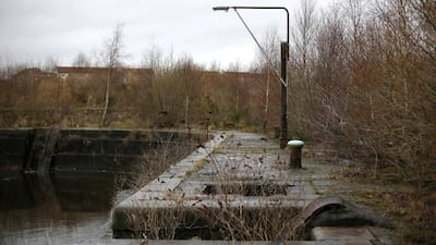 A broken light at the Govan Graving Docks in Glasgow, Scotland. BAE is looking at an option to consolidate production in a single site at Scotstoun. That would mean that shipbuilding in Govan, above, would end. Stefan Wermuth / Reuters
