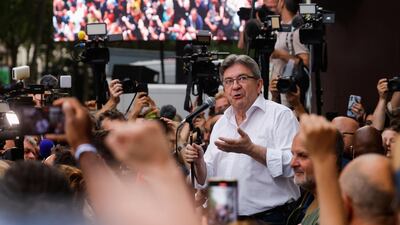 Jean-Luc Melenchon speaks to supporters and media outside Nupes headquarters in Paris. Reuters