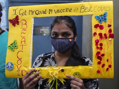 A teenager poses for photos after receiving a Covid-19 vaccine dose at a government hospital, in Hyderabad, India. Photo: AP