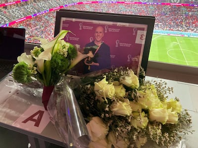 A tribute to journalist Grant Wahl on his assigned seat at Al Bayt Stadium in Al Khor, Qatar. AP