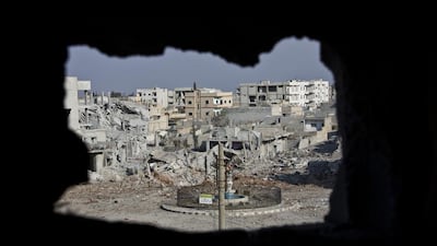 Kurdish fighters have pushed ISIL out of the Syrian town of Kobani. (AP / Jake Simkin)