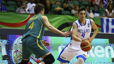 Antonis Koniaris, right, of Greece controls the ball against Dejan Vasiljevic of Australia during their Fiba Under 17 World Championship game at Al Shabab Club on August 12, 2014, in Dubai. Francois Nel / Getty Images