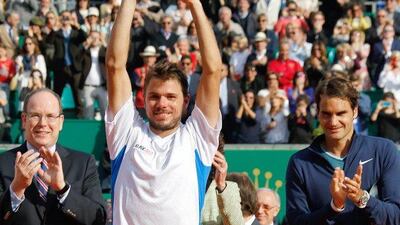 Stanislas Wawrinka lifts the Monte Carlo Masters trophy after his triumph over Roger Federer on Sunday. Claude Paris / AP / April 20, 2014