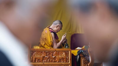 Tibetan spiritual leader the Dalai Lama prays before he starts the third and final day of his annual teaching for Tibetan school and college students at the Tibetan Children's Village School in Dharmsala, India. Ashwini Bhatia / AP Photo