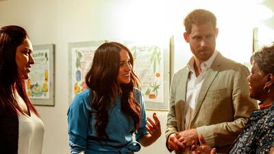 Prince Harry, Duke of Sussex and Meghan, Duchess of Sussex arrive for a visit to the District Six Homecoming Centre in Cape Town as part of their tour of the region on September 23, 2019. Britain's Prince Harry and his wife Meghan arrived in South Africa on September 23, launching their first official family visit in the coastal city of Cape Town. The 10-day trip began with an education workshop in Nyanga, a township crippled by gang violence and crime that sits on the outskirts of the city. / AFP / POOL / POOL / POOL / Bashiera PARKER