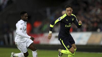 Arsenal's Mesut Ozil, right, of Arsenal. Nick Potts / AP Photo