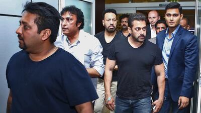 Salman Khan and his entourage arrive at Dubai Airport. The star was granted permission to leave India by a court. Courtesy AIBA