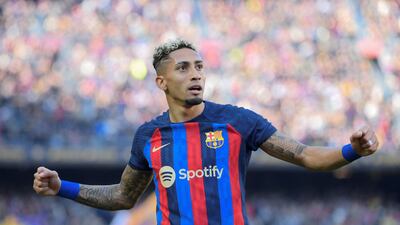 Barcelona forward Raphinha celebrates scoring his team's first goal against Valencia at Camp Nou on Sunday, March 5, 2023. AFP