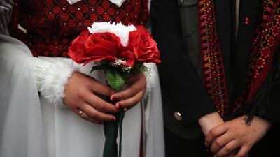 A couple celebrate their wedding at a camp for displaced Palestinians in Deir Al Balah, in the central Gaza Strip, on February 16, 2024. NurPhoto via Getty Images