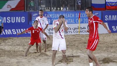 Dimitriy Shishin of Russia, centre, reacts to missing a late penalty to tie the game. Iran went on to win 4-3 to take the title at the Samsung Beach Soccer Intercontinental Cup. Jake Badger for The National
