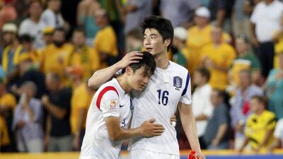 South Korea's Kim Jin-su (L) and Ki Sung-yueng celebrate after their Asian Cup Group A soccer victory against Australia at the Brisbane Stadium on January 17. Edgar Su / Reuters