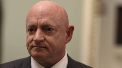 Mark Kelly, a Democratic senator, is banned though his wife, Gabby Giffords, is not. Getty Images / AFP