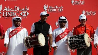 Tiger Woods, centre – with Lee Westwood, left, and Rory McIlory, right – joined Emirati dancers on stage. Woods said he makes it a requisite that he plays different events during the year and experiences new places.