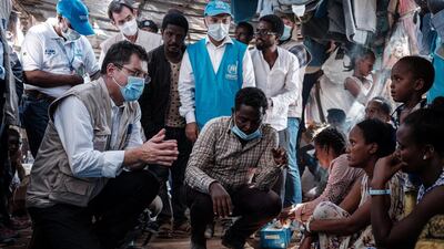 Janez Lenarcic, left, the European Commissioner for Crisis Management, speaks with Ethiopian refugees who fled the Tigray conflict during his visit to Um Raquba reception camp in Sudan on December 3, 2020. AFP