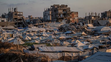 Makeshift shelters of displaced Palestinian families between the remains of their bombed houses in Gaza city. EPA