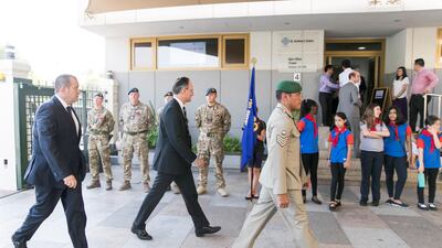 British Ambassador Philip Parham, second to left, arrives at St Andrew's Church Remembrance Day service in Abu Dhabi. Reem Mohammed / The National