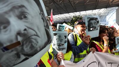 Employees of Ryanair wear masks with the picture of Ryanair CEO O'Leary during a strike at the airport in Frankfurt Main. EPA
