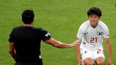 Takefusa Kubo of Japan looks to the referee during the 1-1 draw against Ecuador. AFP