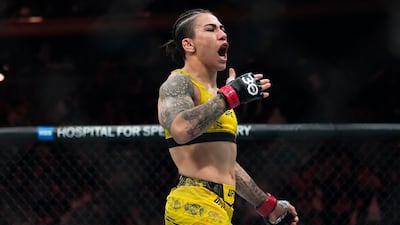 Jessica Andrade celebrates after her win in the strawweight bout against Mackenzie Dern at UFC 295. AP