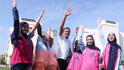 Former Everton and Australia forward Tim Cahill poses for a picture with Lebanese schoolchildren. AFP