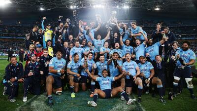 Waratahs players celebrate their Super Rugby title triumph. The New Sout hWales side begin their title defence on Sunday. Matt King / Getty Images