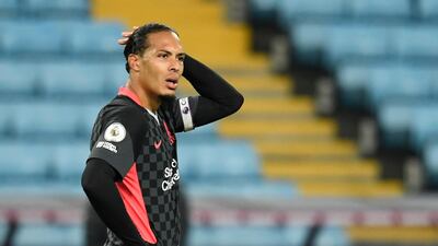 Liverpool's Virgil van Dijk looks dejected after Villa scored their seventh goal. Reuters