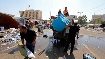 Supporters of Mr Al Sadr pack up belongings as they prepare to leave the Green Zone. AP