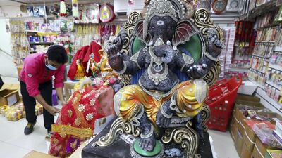 Colourful Ganesh statues made of plaster at the Madhoor store in Bur Dubai. Environmentalists are urging worshippers to choose more eco-friendly idols to immerse in the sea. Pawan Singh / The National