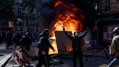 Demonstrators clash with police during the annual May Day march in Paris on May 1. EPA