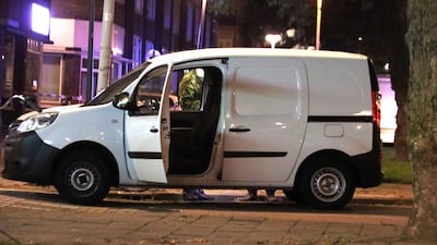Police examine a van packed with gas canisters found close to where US band the Allah-Las were due to perform. EPA/ARIE KIEVIT